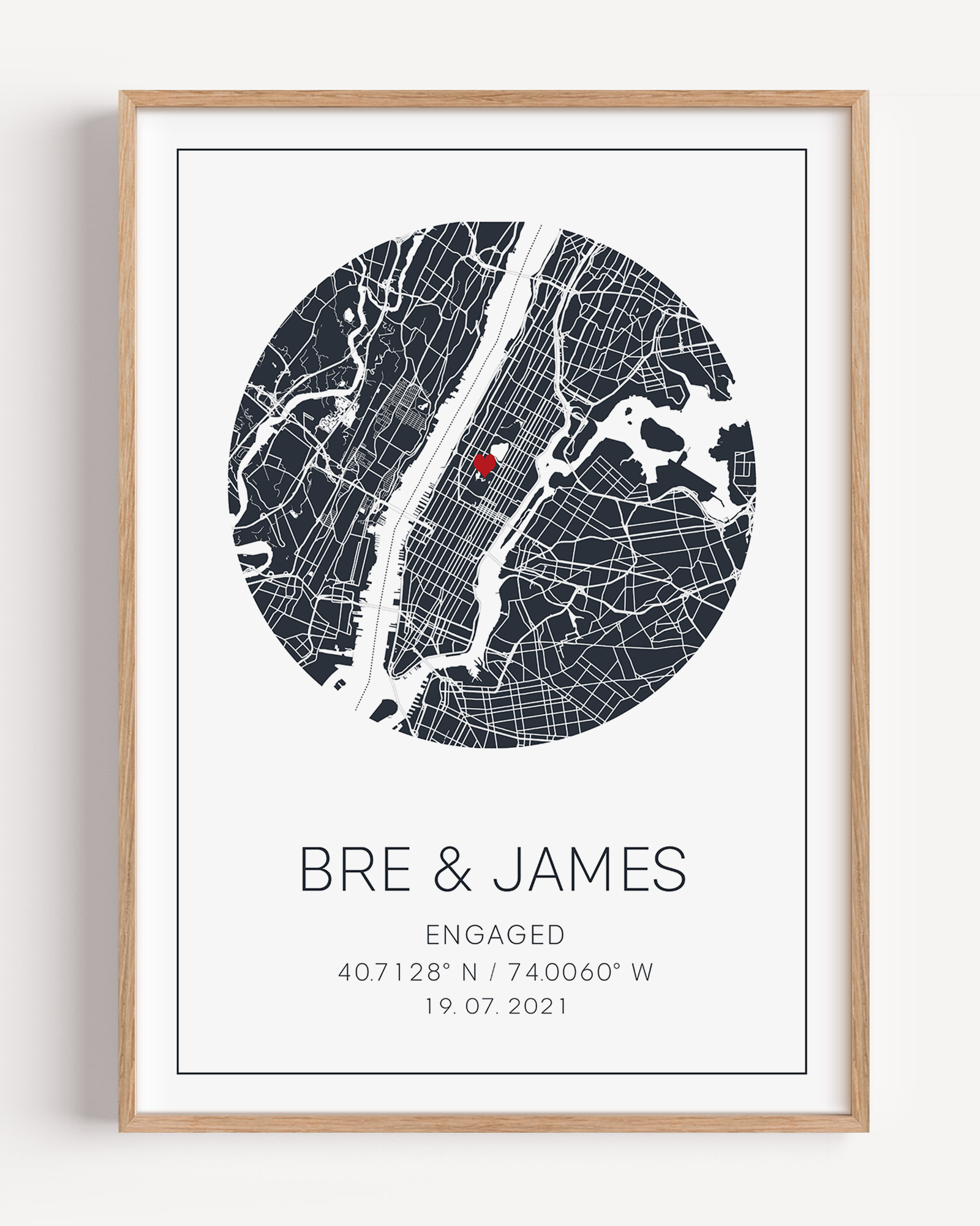 Personalized engagement circle map print featuring a minimalist grey street map within a circular frame, with a red heart marking the proposal location and custom couple names and engagement date in elegant script below.