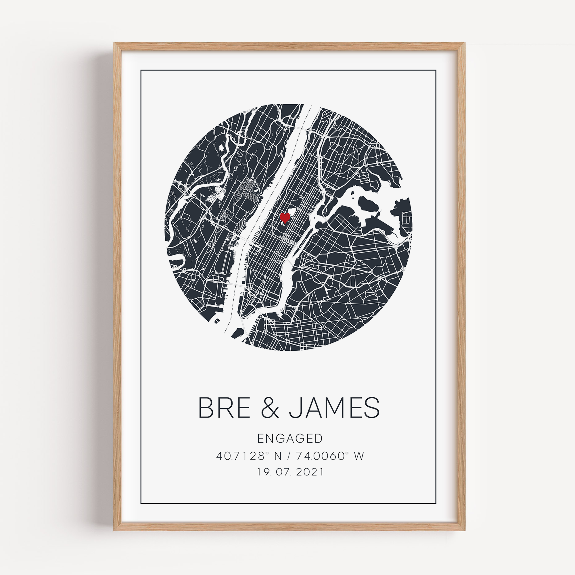 Personalized engagement circle map print featuring a minimalist grey street map within a circular frame, with a red heart marking the proposal location and custom couple names and engagement date in elegant script below.