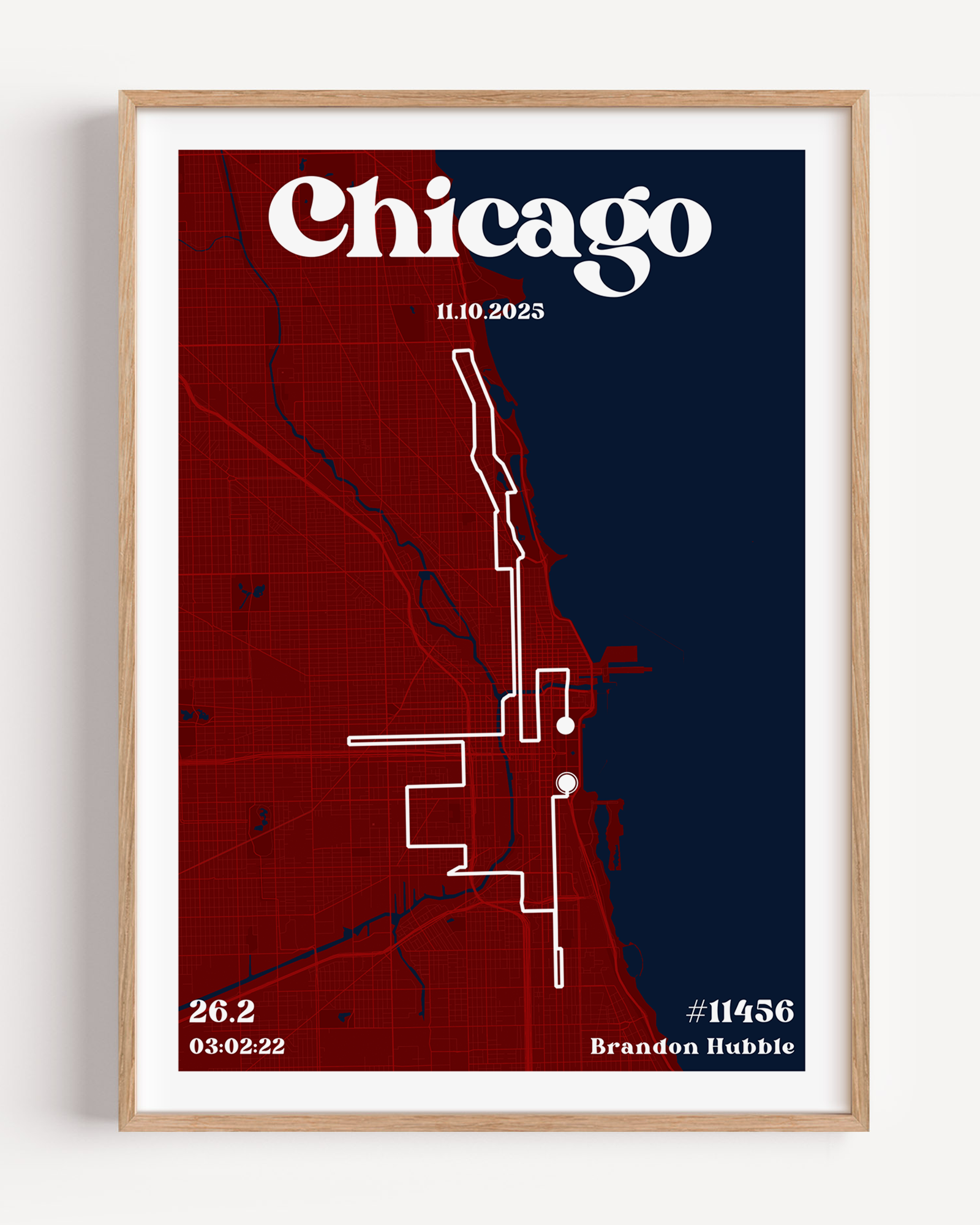 A custom marathon map poster featuring the Chicago city street grid and race route. The design includes "Chicago" in a bold, vintage serif font at the top, along with the race date, finishing time, distance, bib number, and the runner’s name.
