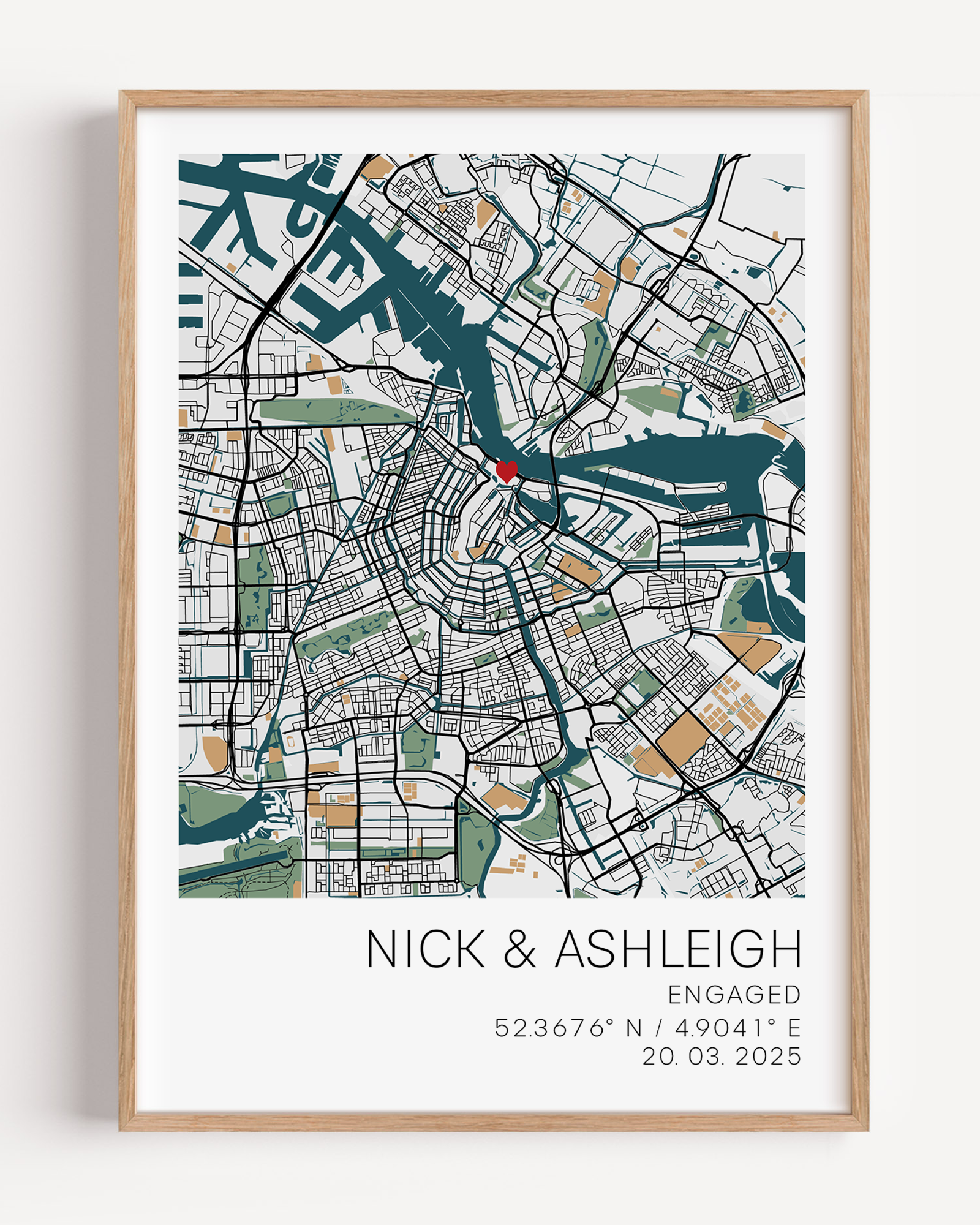 Custom engagement map print showing a colourful map of the proposal location with a small red heart marker, personalized cursive names and date text below on white background