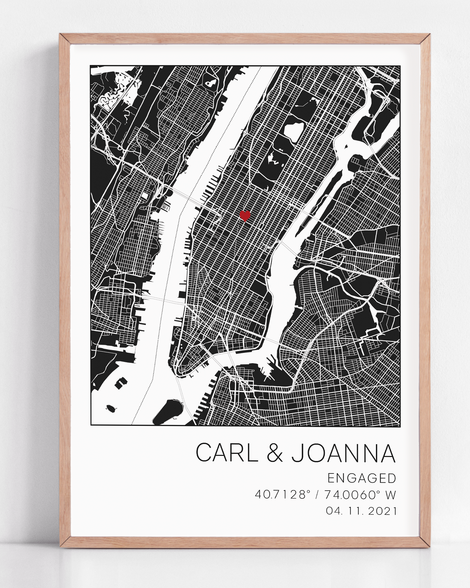 Modern framed engagement map print featuring minimalist black street lines with a red heart pinpoint marking the proposal location, personalized with couple’s names and engagement date in elegant script”
