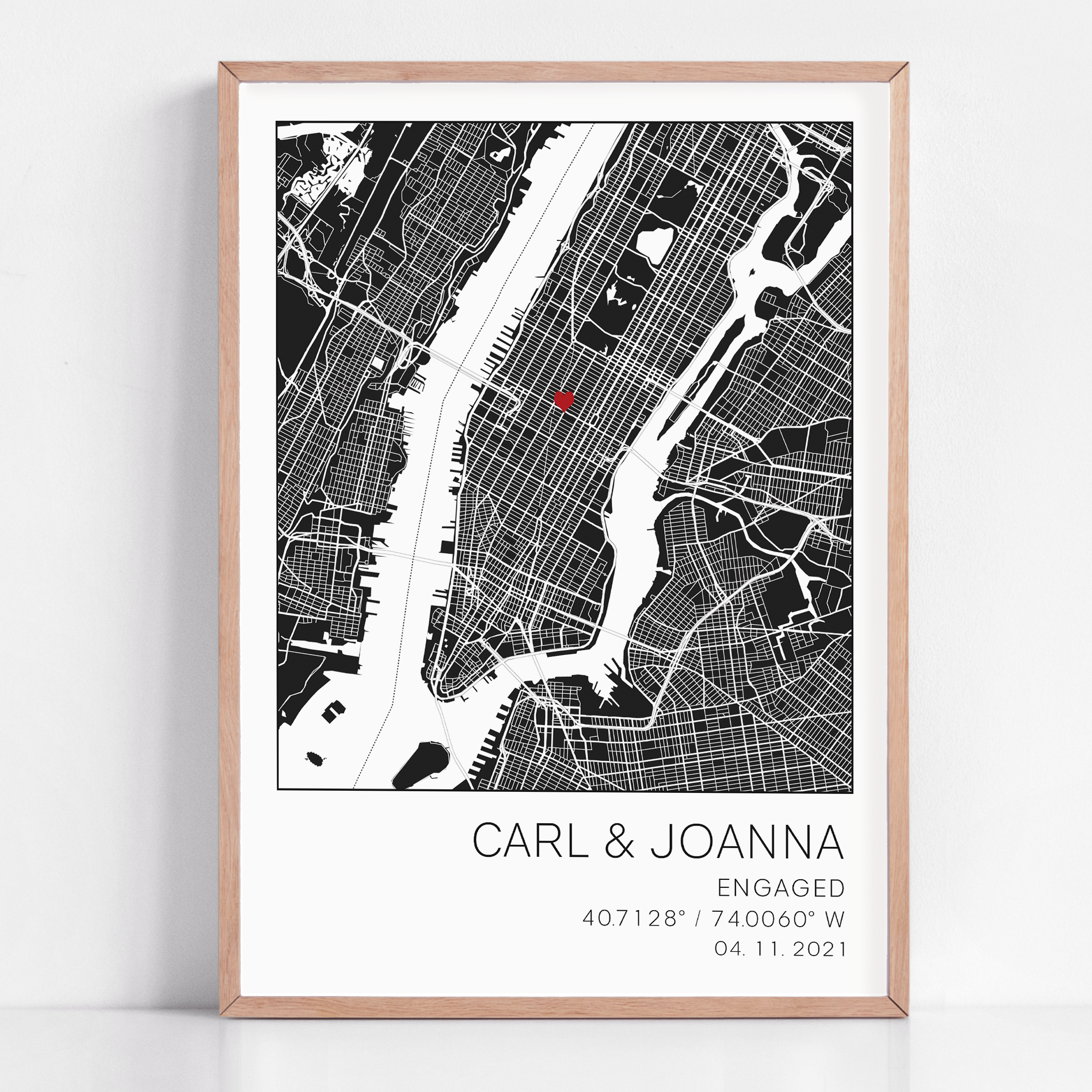 Modern framed engagement map print featuring minimalist black street lines with a red heart pinpoint marking the proposal location, personalized with couple’s names and engagement date in elegant script”