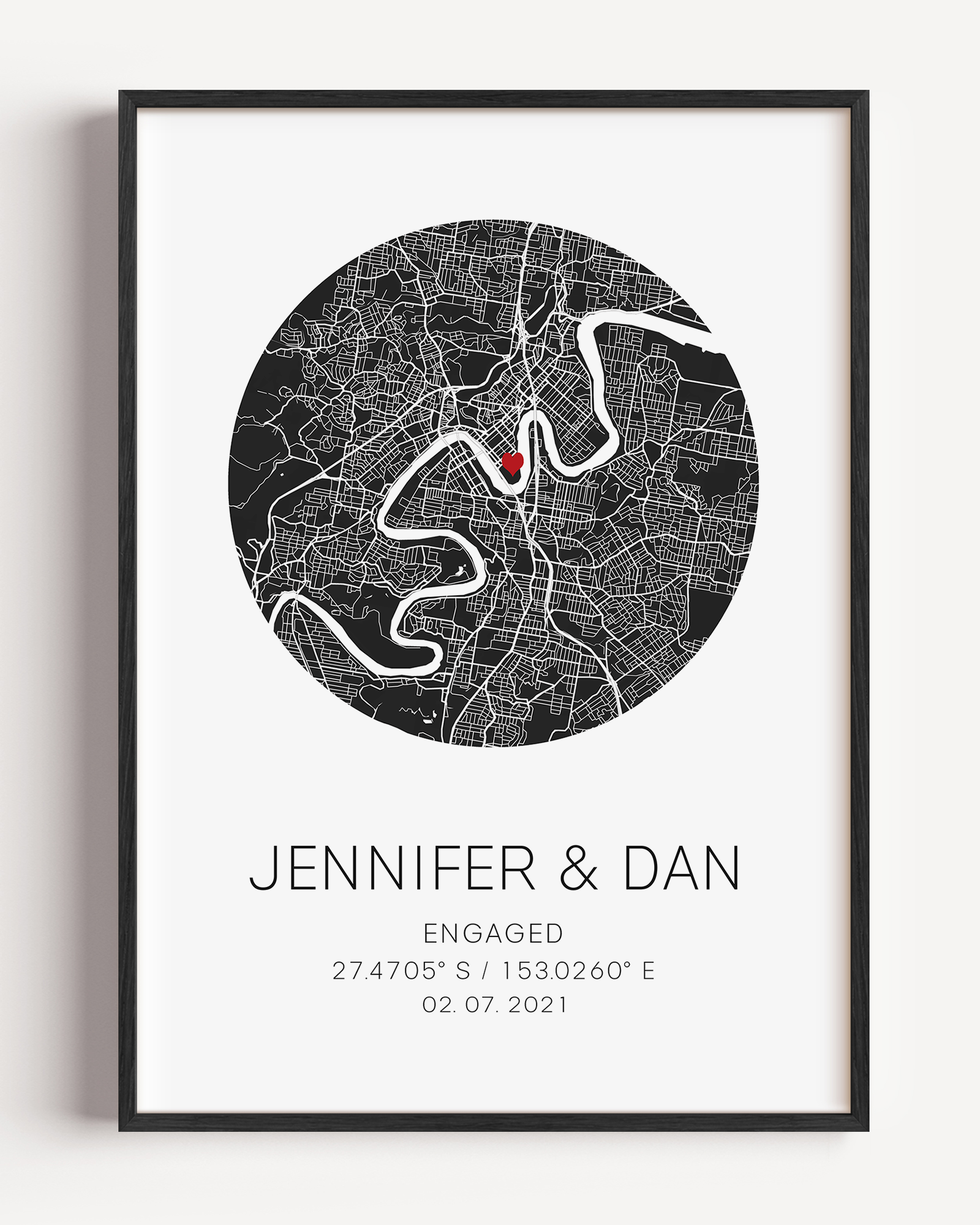 Personalized engagement circle map print featuring a minimalist grey street map within a circular frame, with a red heart marking the proposal location and custom couple names and engagement date in elegant script below.