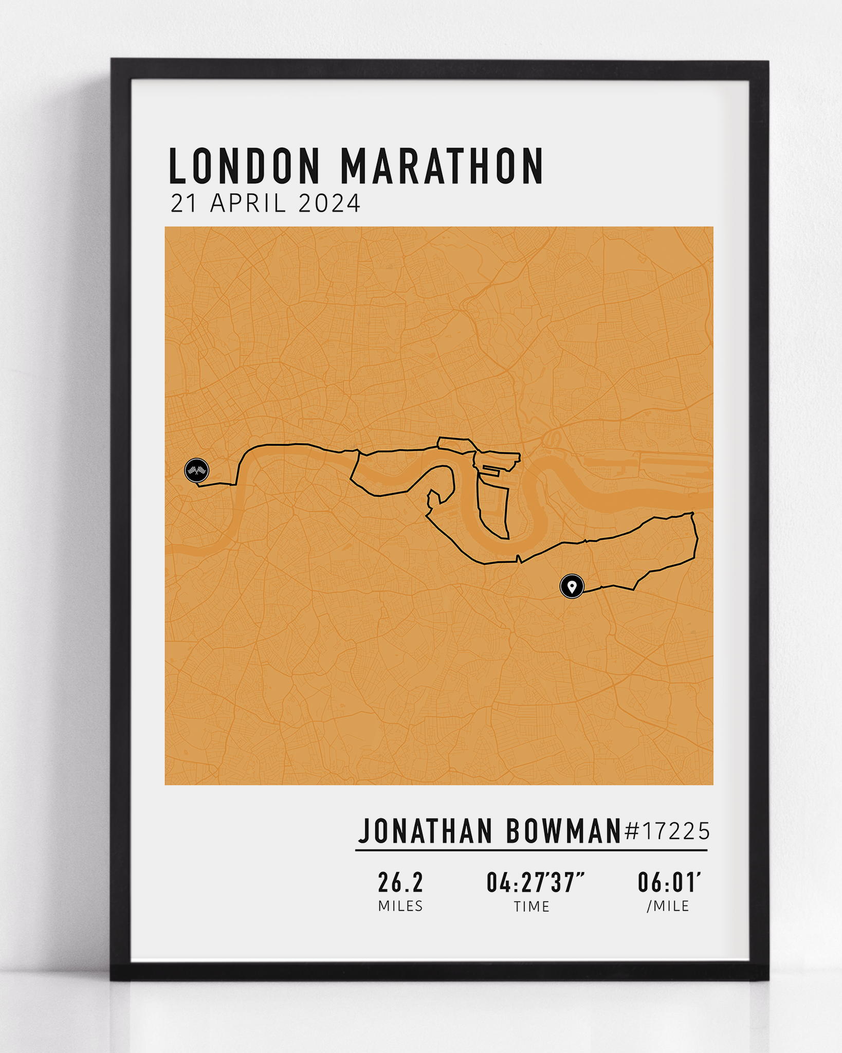 Framed custom art print of a marathon route, showing a minimalist line map of the running course with labeled start and finish points, event name, date, and distance.
