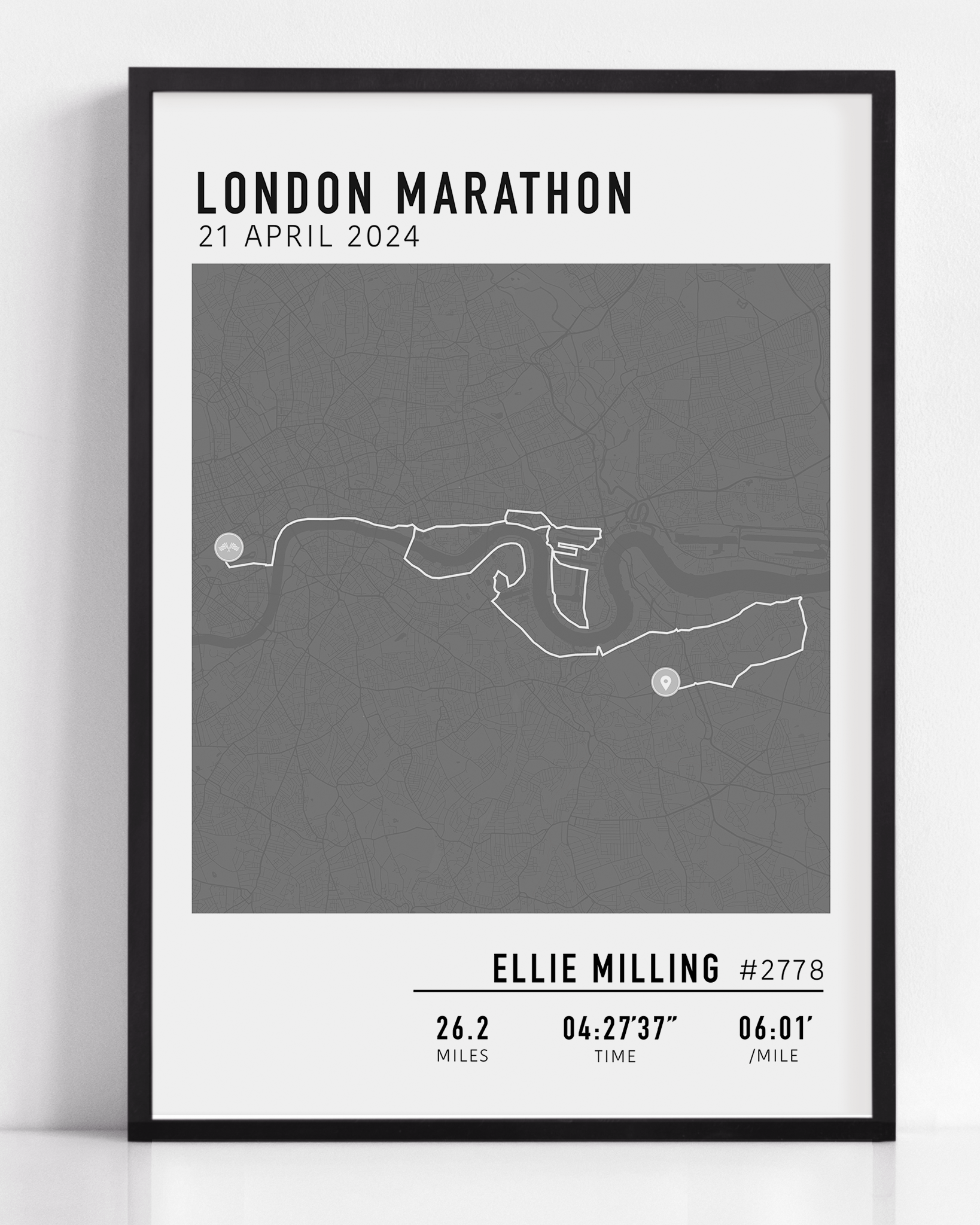 Framed custom art print of a marathon route, showing a minimalist line map of the running course with labeled start and finish points, event name, date, and distance.