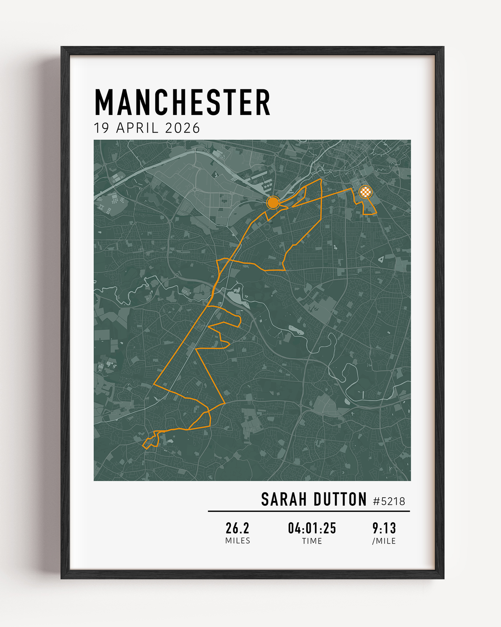 Framed Manchester Marathon commemorative display showing a detailed race course map alongside a slot for the finisher medal.