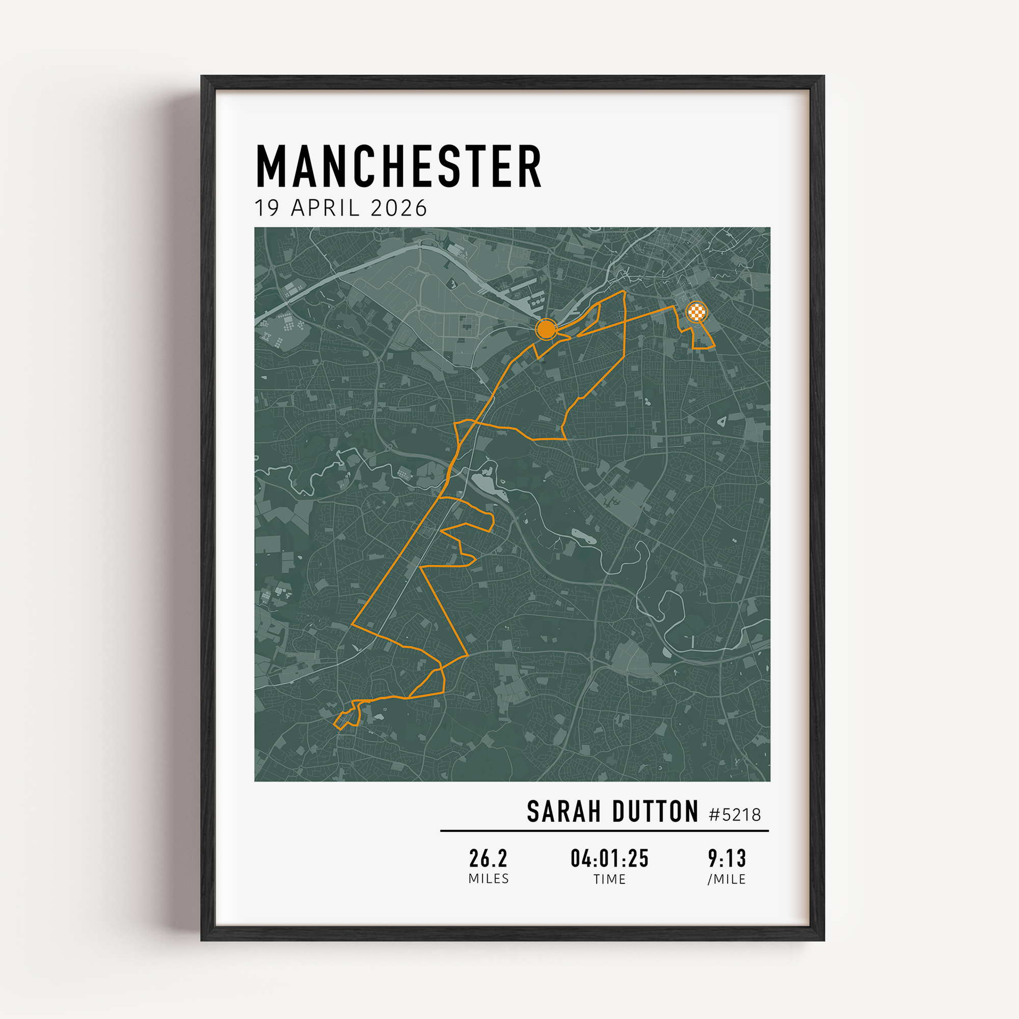 Framed Manchester Marathon commemorative display showing a detailed race course map alongside a slot for the finisher medal.