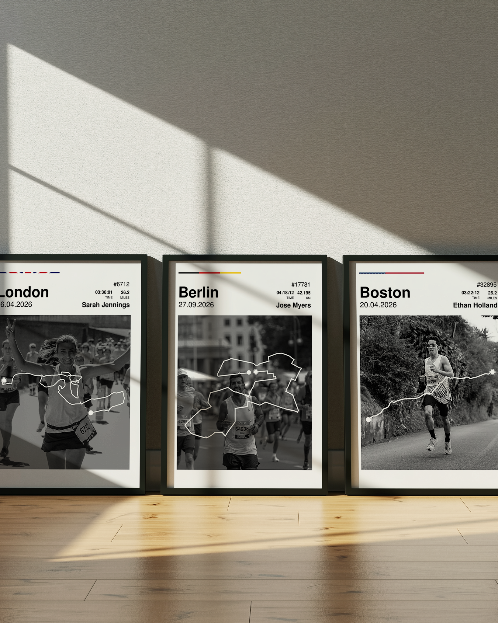 Three framed prints of running routes in London, Berlin, and Boston on a wall.