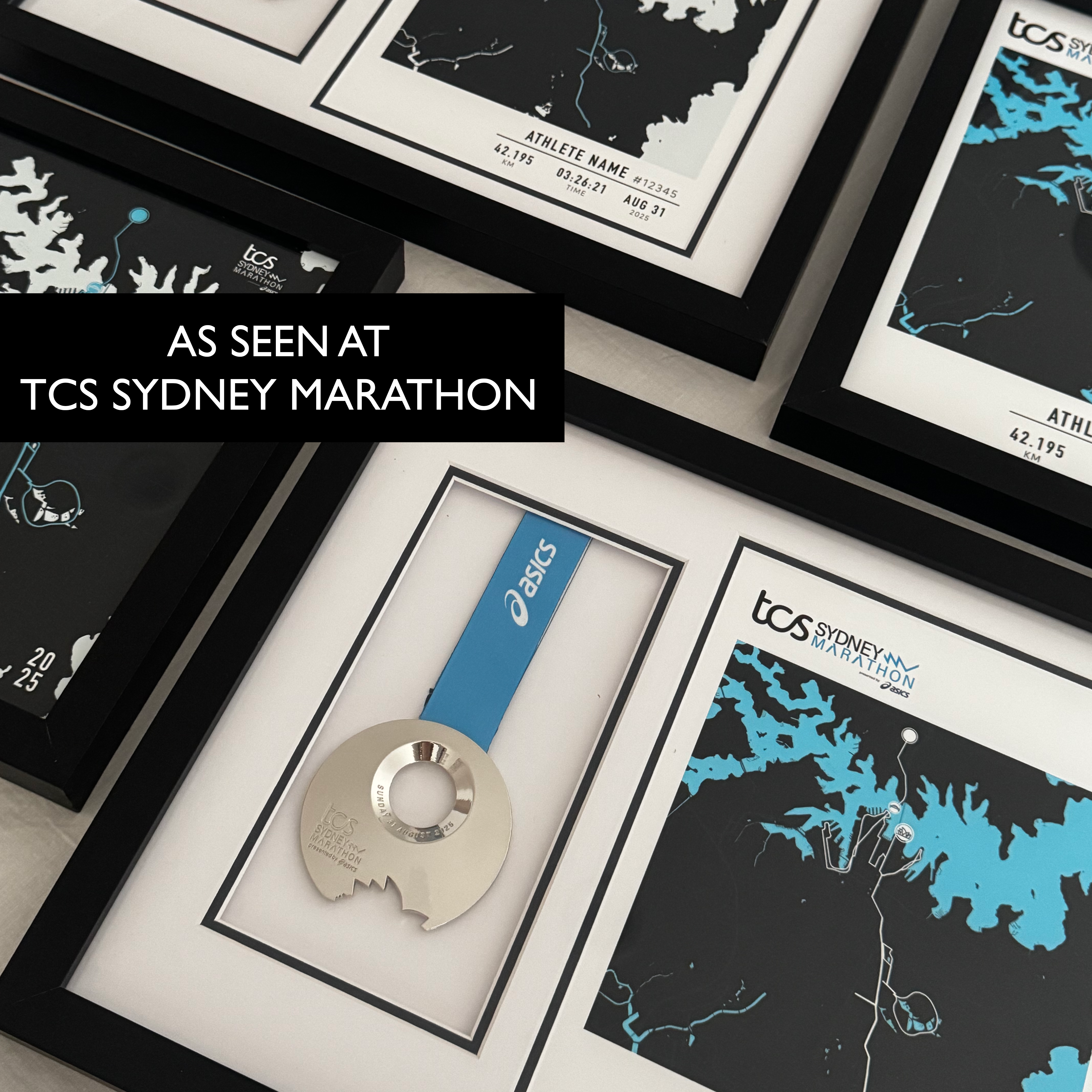 Framed maps and a medal with TCS Sydney Marathon branding.