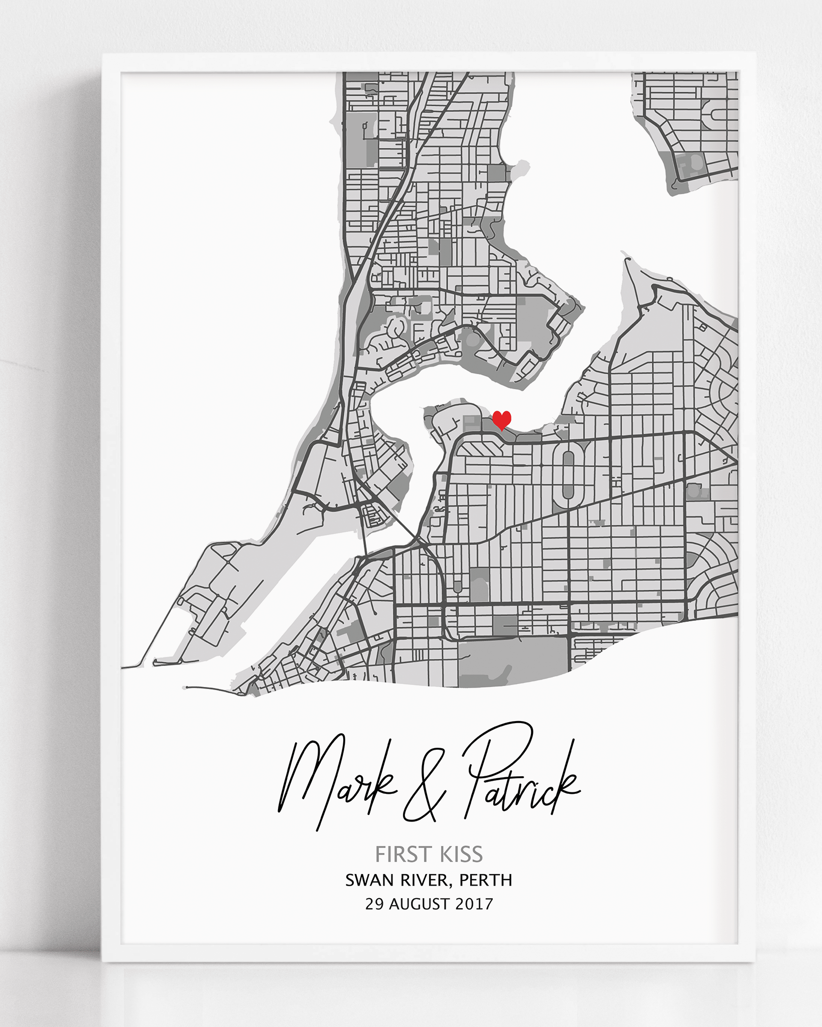 a framed print of a personalized first kiss map print. A custom design that is personalized to your date, location and couple's names gift.