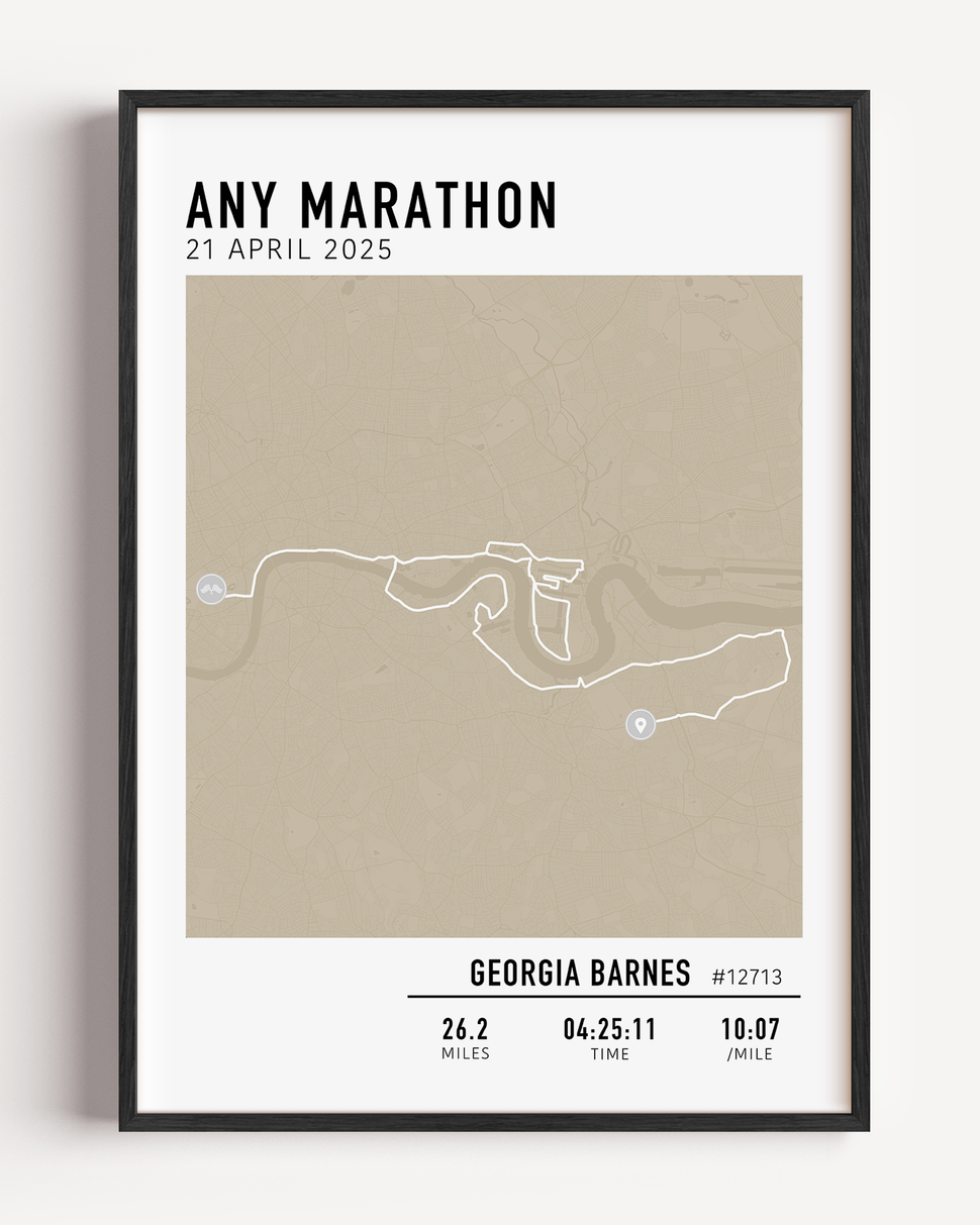 Framed custom art print of a marathon route, showing a minimalist line map of the running course with labeled start and finish points, event name, date, and distance.