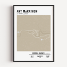 Framed custom art print of a marathon route, showing a minimalist line map of the running course with labeled start and finish points, event name, date, and distance.