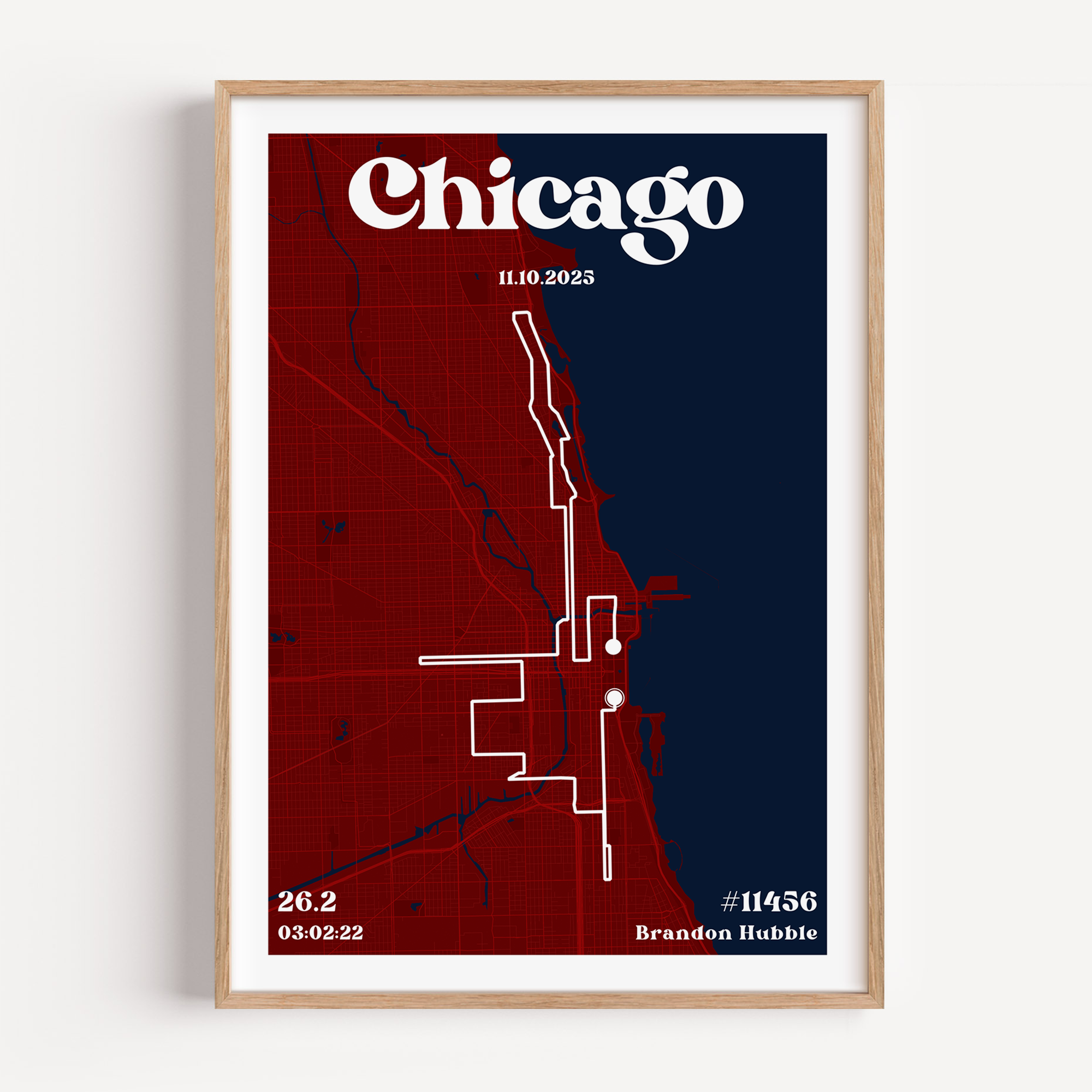 A custom marathon map poster featuring the Chicago city street grid and race route. The design includes "Chicago" in a bold, vintage serif font at the top, along with the race date, finishing time, distance, bib number, and the runner’s name.