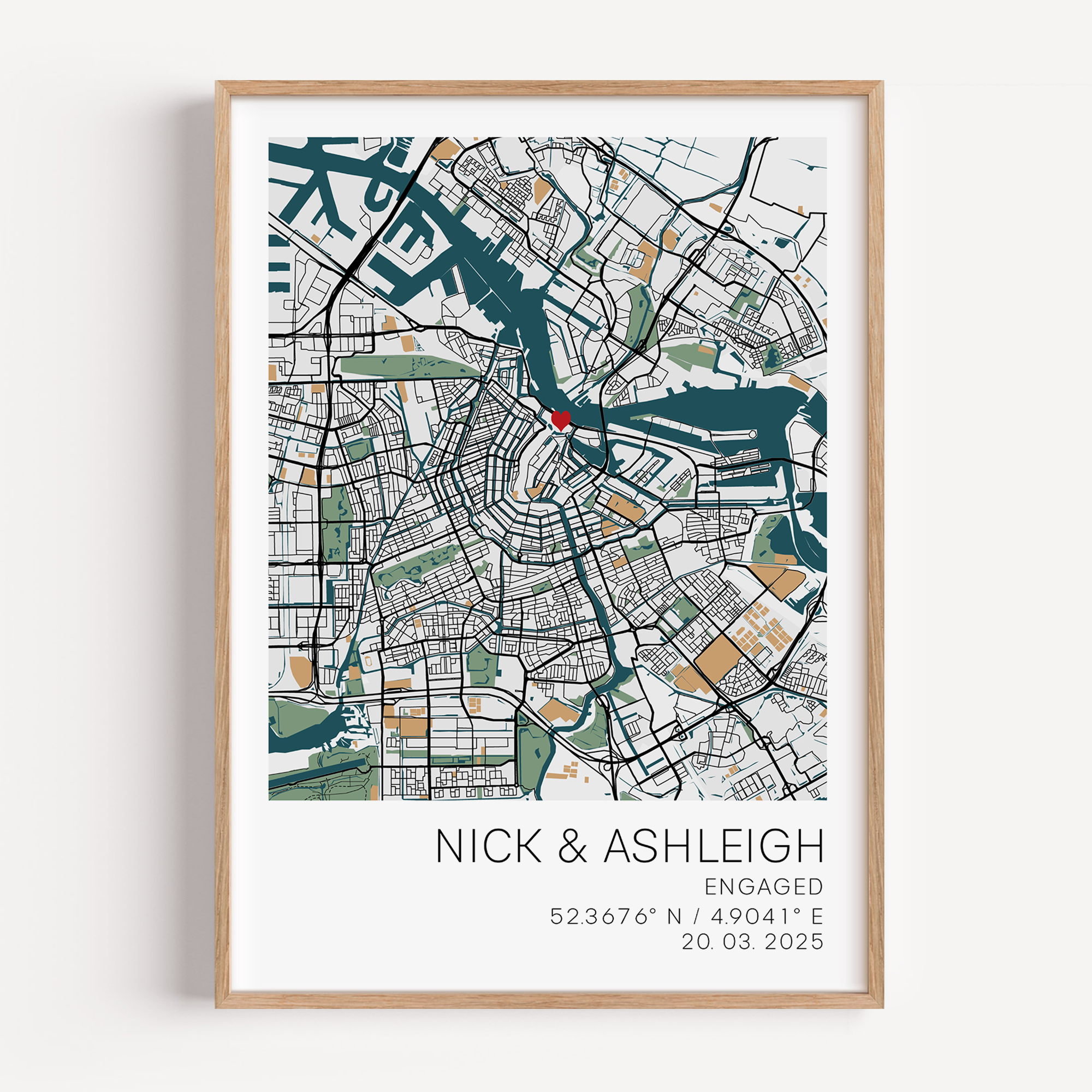 Custom engagement map print showing a colourful map of the proposal location with a small red heart marker, personalized cursive names and date text below on white background