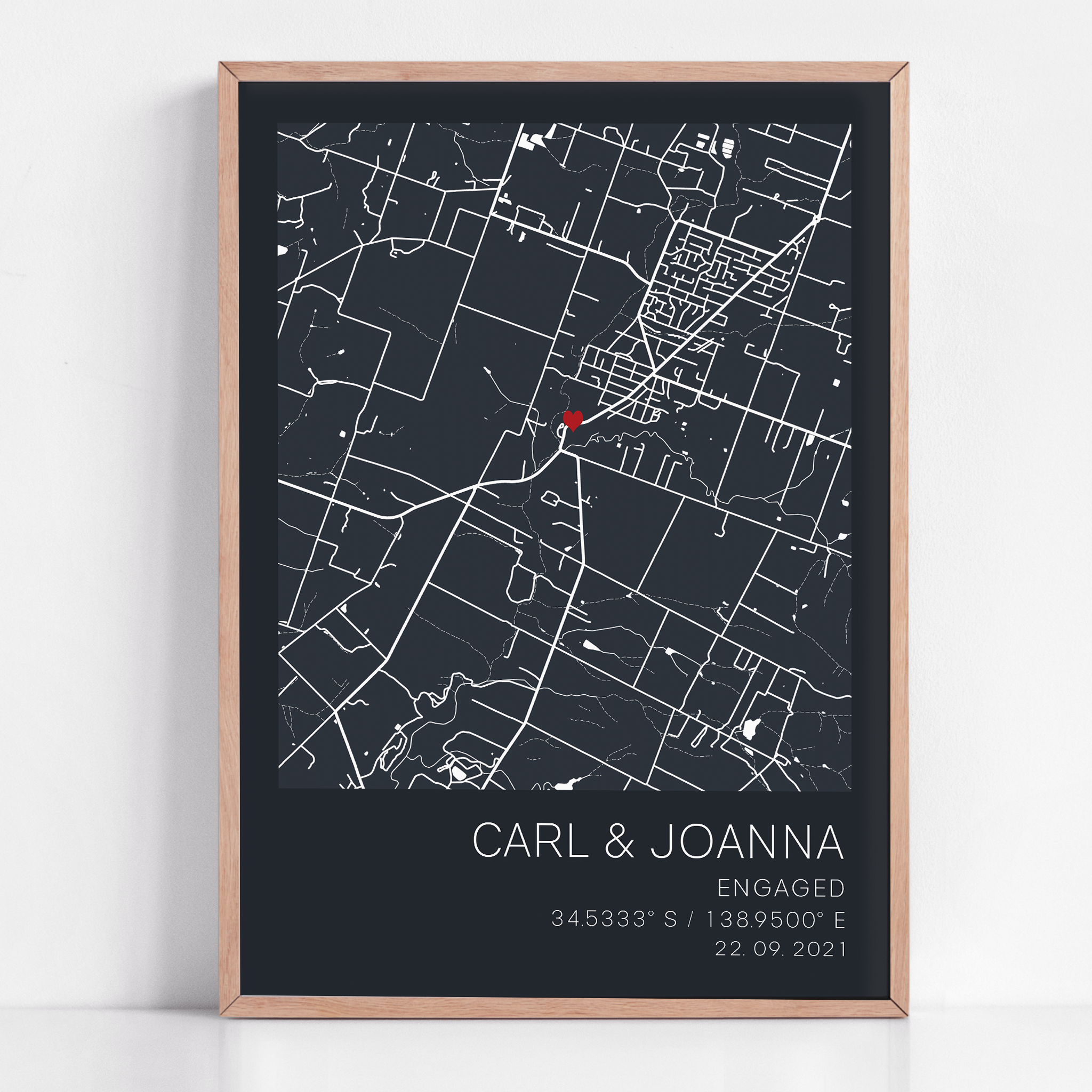 Custom engagement gift: modern city map print with red heart location marker, framed and personalized with names and proposal date in sleek typography