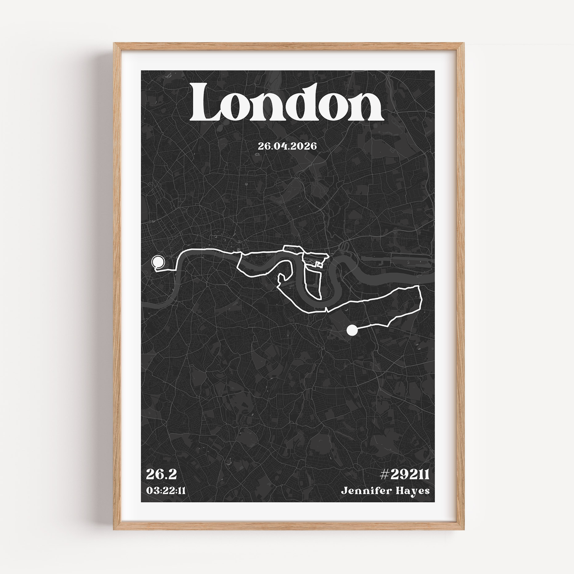 A personalised London Marathon map print showcasing the iconic race route through the city streets. The artwork features "London" in stylish typography at the top, with customisable details such as the runner's name, official time, and event date displayed at the bottom.