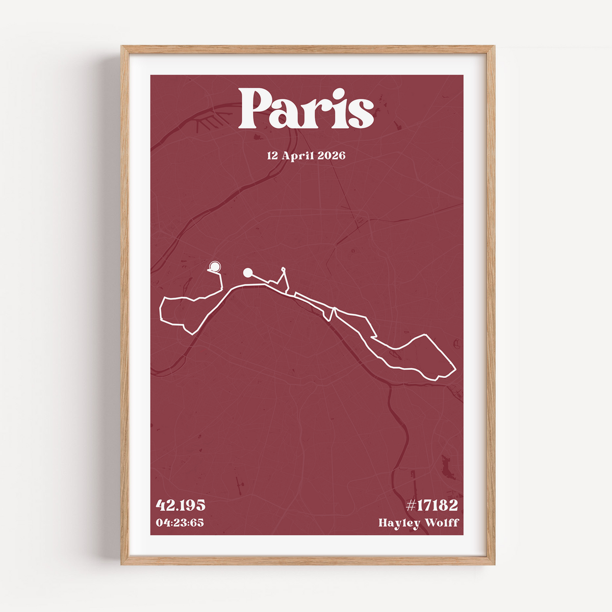Side angle view of the Paris Marathon Urban map print in a premium oak frame. The shot highlights the high-quality matte paper finish and the bold, minimalist design of the marathon course winding through the city of Paris.