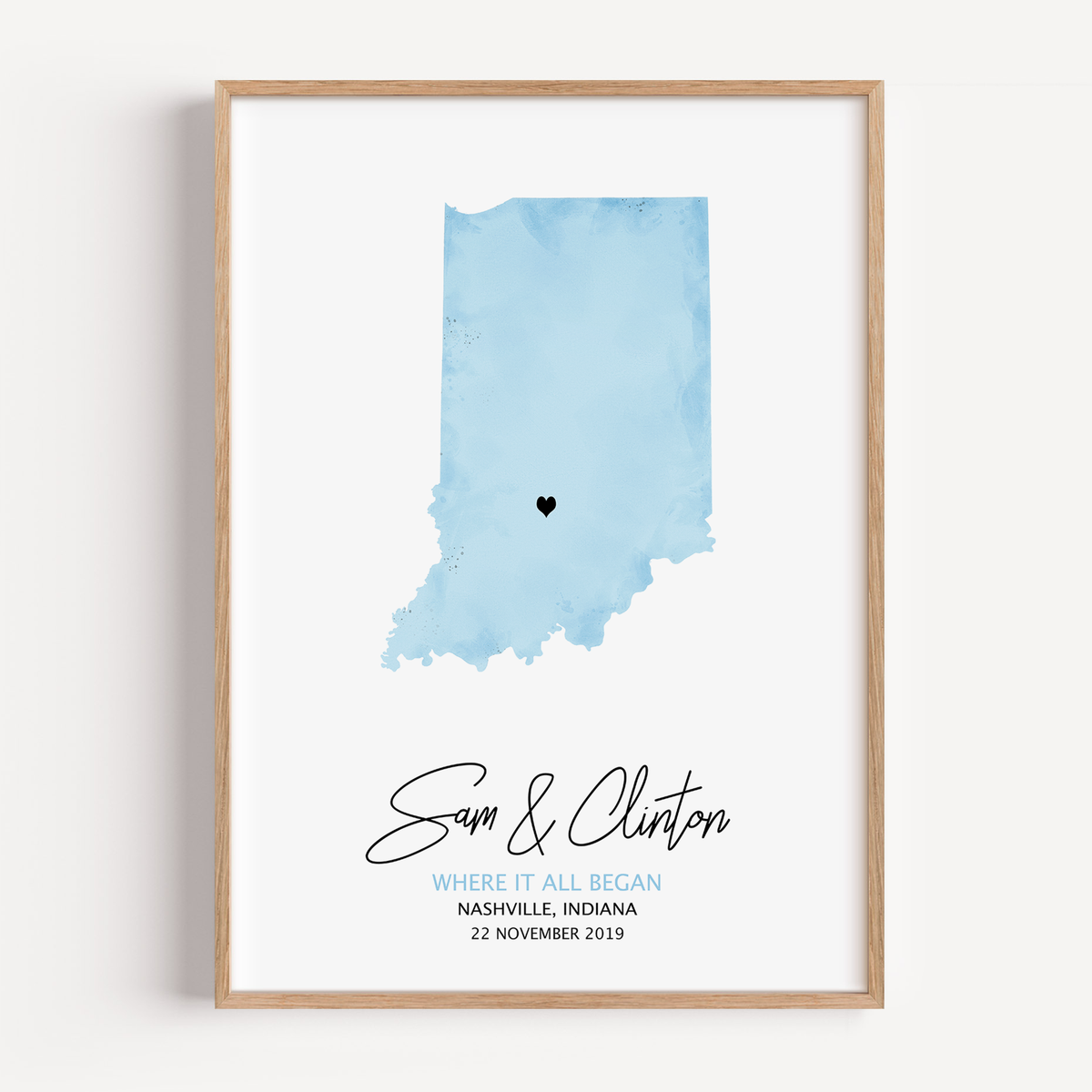 Framed custom watercolor map print of the location where a couple first met, personalized with names and date – sentimental artwork gift.